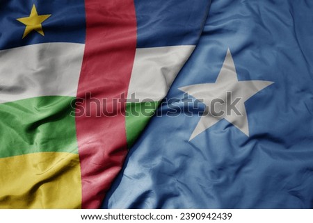 big waving national colorful flag of somalia and national flag of central african republic . macro