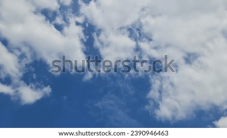 Blurred sky background image, morning sky in the rainy season with beautiful white clouds scattered in the bright blue sky. 