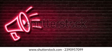 Neon sign on a brick wall - Megaphone