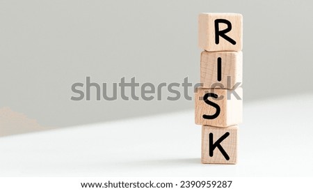Word Risk made of wooden cubes on white background Royalty-Free Stock Photo #2390959287