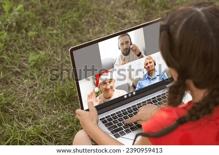 Chat online with family on laptop on picnic in nature. Homeschooling, freelance job. Mom and child. Mother work on Internet with kid outdoors. Quarantine, closed nursery school during coronavirus