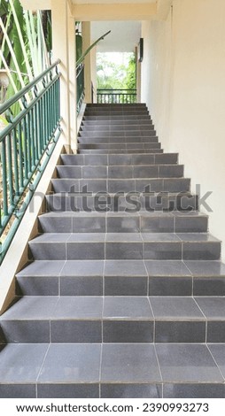 photo of traditional hotel stairs, black, suitable for promotional media for buildings and hotels