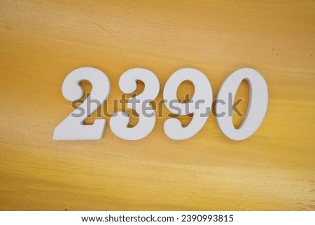 The golden yellow painted wood panel for the background, number 2390, is made from white painted wood.