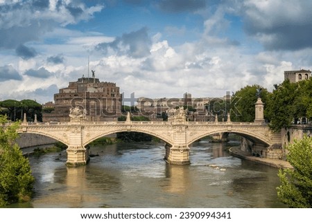 Beautiful view of medieval Saint Angelo castle and Vittorio Emanuele II Bridge over Tiber river in Rome, Italy Royalty-Free Stock Photo #2390994341