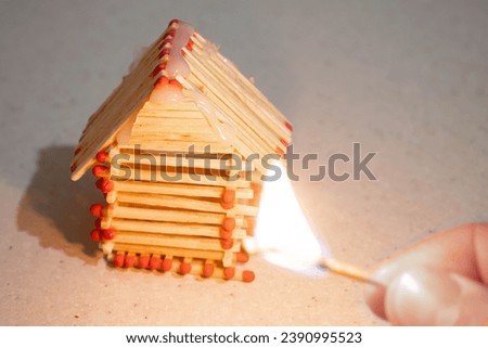 The house model is made of matches. Fire hazard concept.