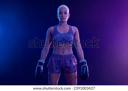 The Boxing. Brazilian woman boxer. Sportsman muay thai boxer fighting in gloves. Isolated on black background. Copy Space.