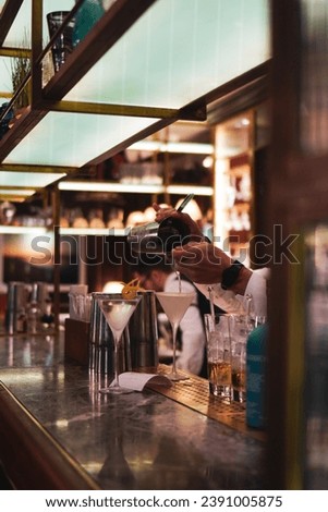 The allure of London's nightlife through captivating photos of a bar boasting a cosy, fancy, dark, and classy atmosphere. These images showcase the intimate and sophisticated ambiance, featuring plush