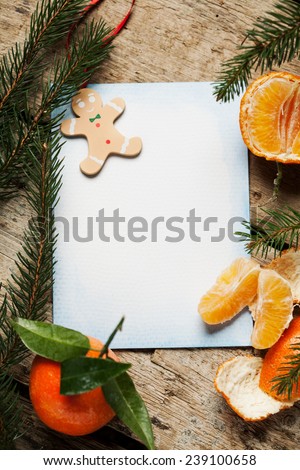 Christmas decoration with blank paper on wooden background