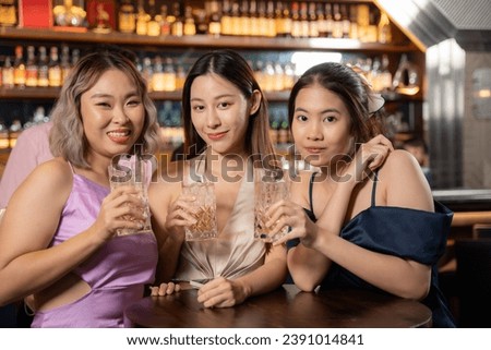 Portrait Group of Beautiful Asian Woman Enjoying with Friend in Bar. They Enjoying with Night Party Moment Together. Party, Lifestyle, Happiness, Cheerful and Celebration Concept.