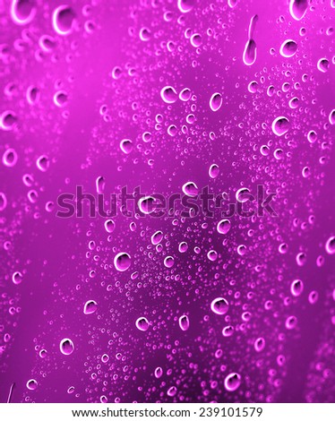 Drops of water on the glass a pink