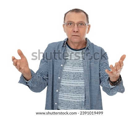 Portrait of serious, concerned sixty year old man asking WHAT HAPPENED, WHAT IS THE PROBLEM, isolated on white background. Guy with upset questioning face posing in studio.