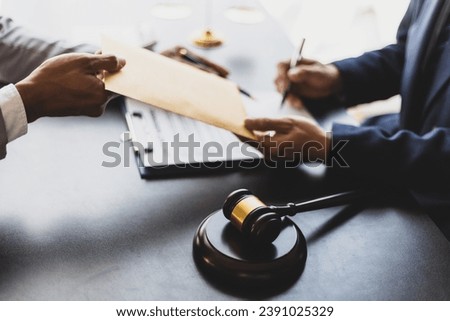 Businessman, lawyer submits legal appeal documents to court. Taking bribes of officials. Royalty-Free Stock Photo #2391025329