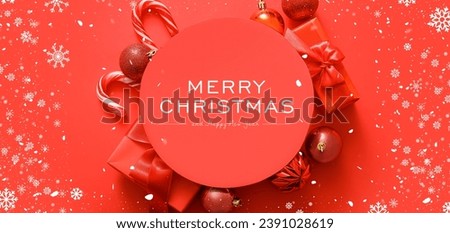 Greeting card for Christmas and New Year with decorations and gifts on red background