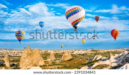 The great tourist attraction of Cappadocia - balloon flight. Cappadocia is known around the world as one of the best places to fly with hot air balloons. Goreme, Cappadocia, Turkey.Artistic picture. 