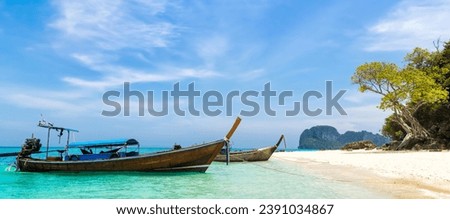 Amazing view of beautiful beach with traditional thailand longtale boat. Location: Bamboo island, Krabi province, Thailand, Andaman Sea. Artistic picture. Beauty world.
