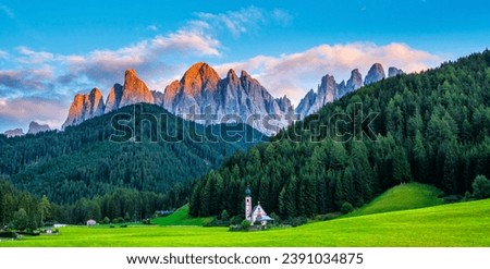 Wonderful landscape of Dolomite Alps during sunset. St Johann Church, Santa Maddalena, Val Di Funes, Dolomites, Italy. Amazing nature background. Artistic picture. Beauty world.  Panorama