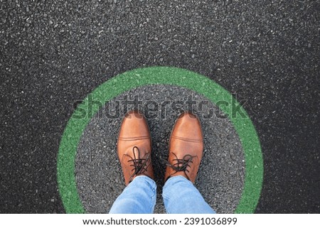 Comfort zone concept. Feet standing inside comfort zone circle. Royalty-Free Stock Photo #2391036899
