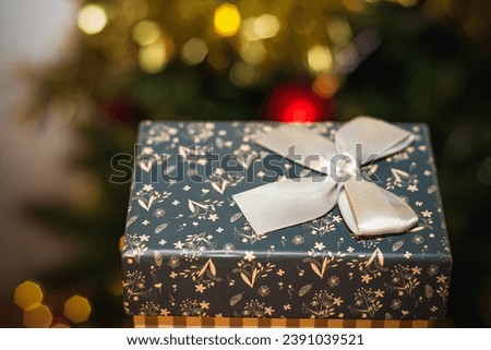 New Year composition on light background with Gift box