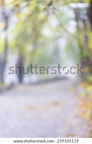 De-focused view of autumn with bright and soft gold, orange and green flowers and beautiful bokeh blurred, as the basis for an unusual artistic abstract background romantic design