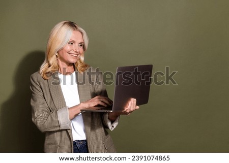 Photo of expert businesswoman using laptop couching her students how open first business ecommerce store isolated on khaki color background