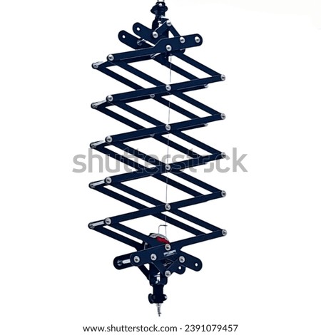 Detail of a photographic pantograph hanging on a plain white background