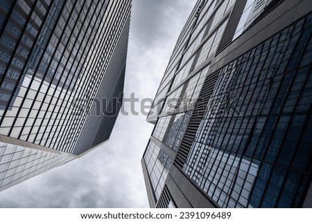 Buildings and skyline of Manhattan against moody sky