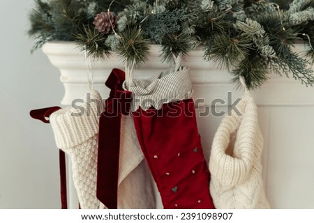 Close up of Christmas Stockings hung on holiday Season Fireplace