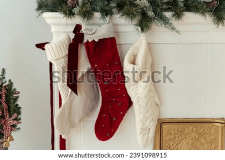 Christmas stockings hanging by fireplace at home