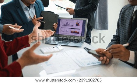 group businessmen and investors met together in conference room to view annual results their investments in business together in order to plan marketing doing business that would produce better result Royalty-Free Stock Photo #2391102785