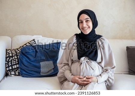 Portrait for pregnant female in home with smile on her face