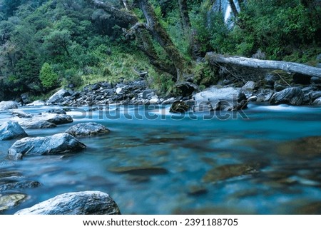 The clear turquoise water at Thunder Creek Falls iin Mount Aspiring National Park, Westland District, New Zealand. It is located in the Haast River valley, inland from Haast
