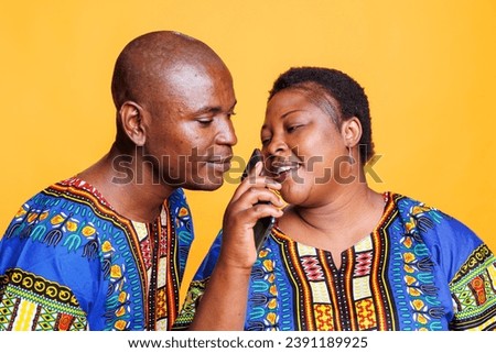 Man and woman couple using mobile phone as microphone. African american singers singing together in smartphone mic, recording song with telephone voice recorder application