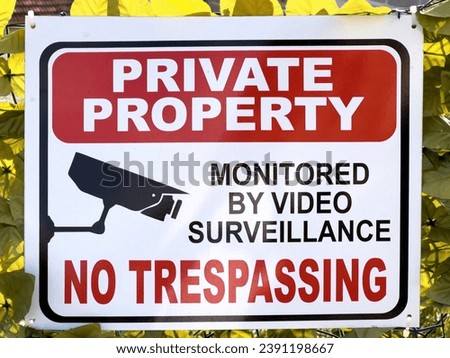 Plaque on the fence. Caption: Private property. No trespassing
