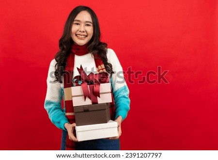 

Happy smiling asian woman holding gift box over red 

Happy smiling asian woman holding gift box over red background.

