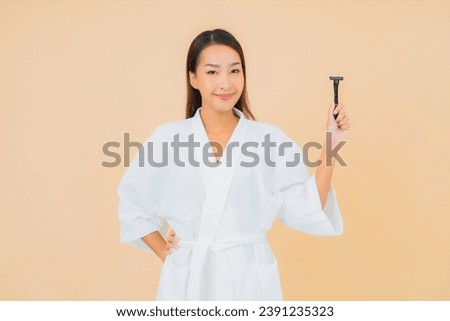 Portrait beautiful young asian woman with shaving on isolated background