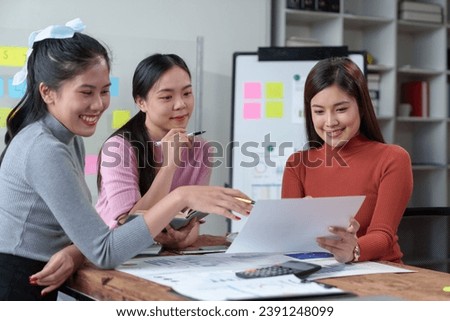 Happy Asian businesswoman working together in office Brainstorming meeting of the online internet technology creative team Business partners or teamwork concept of colleagues in office.