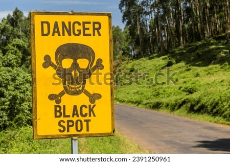 Sign Danger Black Spot near Kericho, Kenya