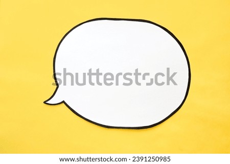 Speech bubble on a yellow background. Comic cloud with a place for text Royalty-Free Stock Photo #2391250985