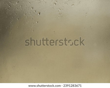 Water drops on brown window for rainy season background