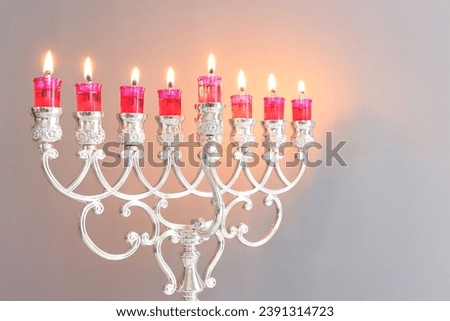 Religion image of jewish holiday Hanukkah background with menorah (traditional candelabra) and candles