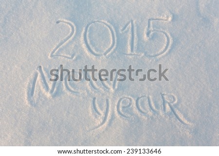 Happy 2015 New Year greetings written on snow