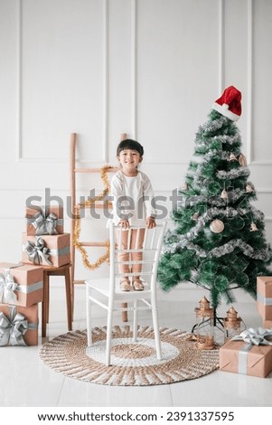 cute asian chinese girl take photos in Christmas decoration