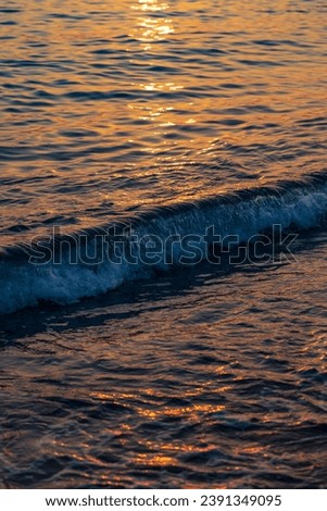 Wonderful orange water in the sea during sunset