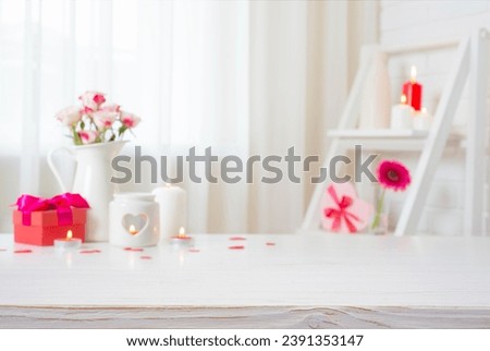 Empty wooden table for your product montage with blur decorated room interior background