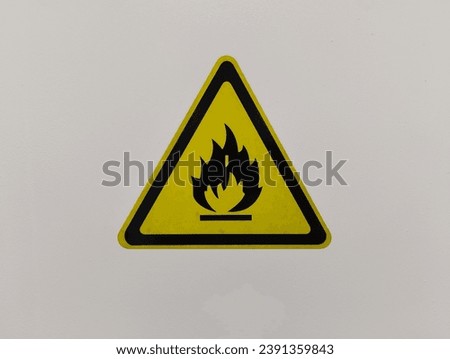 white safety cabinet with flammable warning sign in laboratory