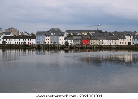 The stunning view of reflection on the lake in Galway colourful houses