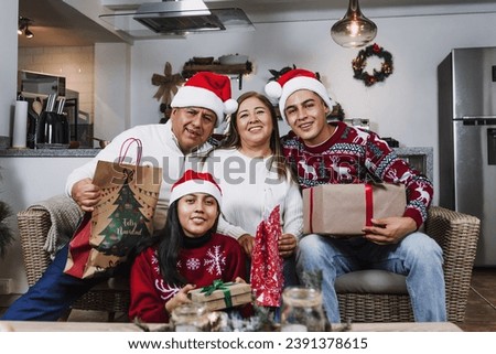 Portrait of Latin family during Christmas eve at home in Mexico Latin America. hispanic people with teenagers daughter, son, mother and father