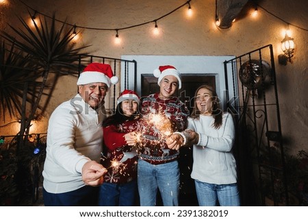 Latin family with sparkling lights and Singing carols in Christmas eve celebration in Mexico, Latin America culture and traditions, Mexican Posadas