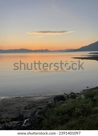 Sunset with a cloud reflected in Balsfjord outside of Tromsø, picture taken from Andersdal