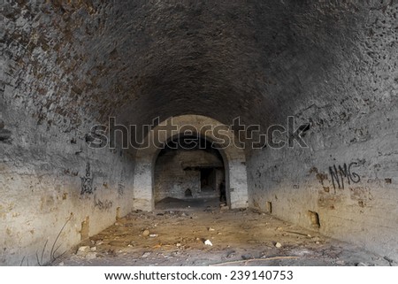Old abandoned tunnel in the underground wine cellar. Entrance to the catacombs in Odessa, Ukraine. As a creative background for staged dark design